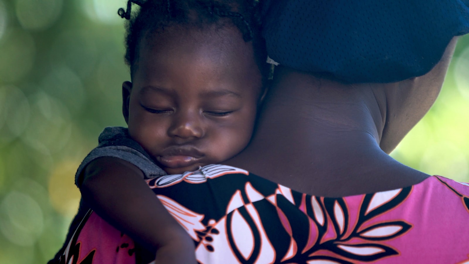 A mother holding her baby